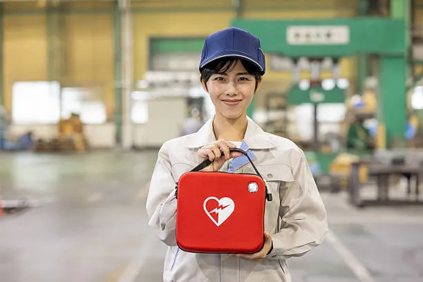 Asian Worker With Automated External Defibrillator (rescue Training)